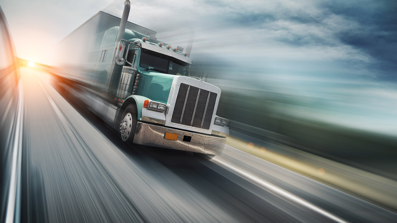 American truck speeding on freeway