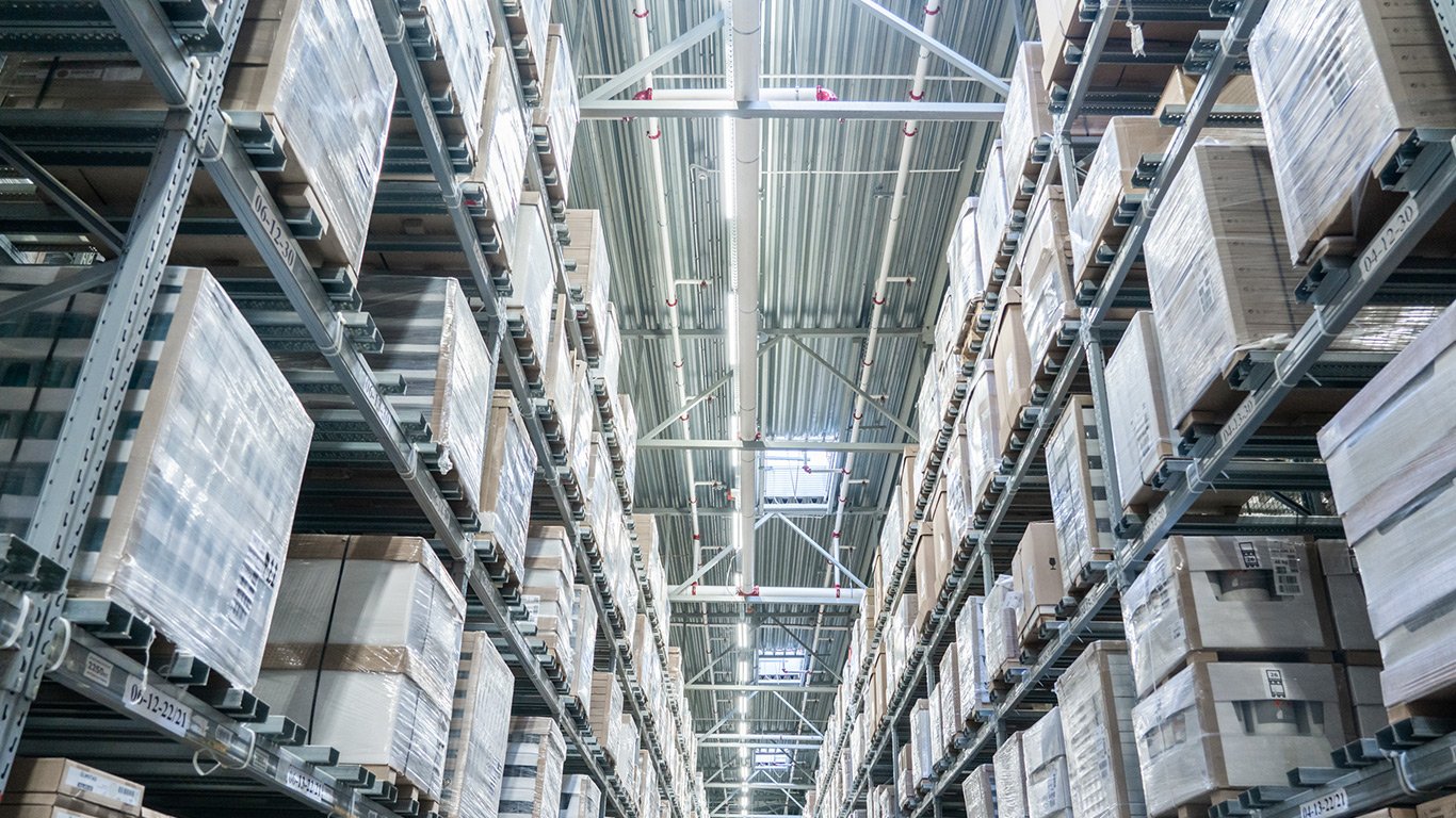 Rows of shelves in modern warehouse